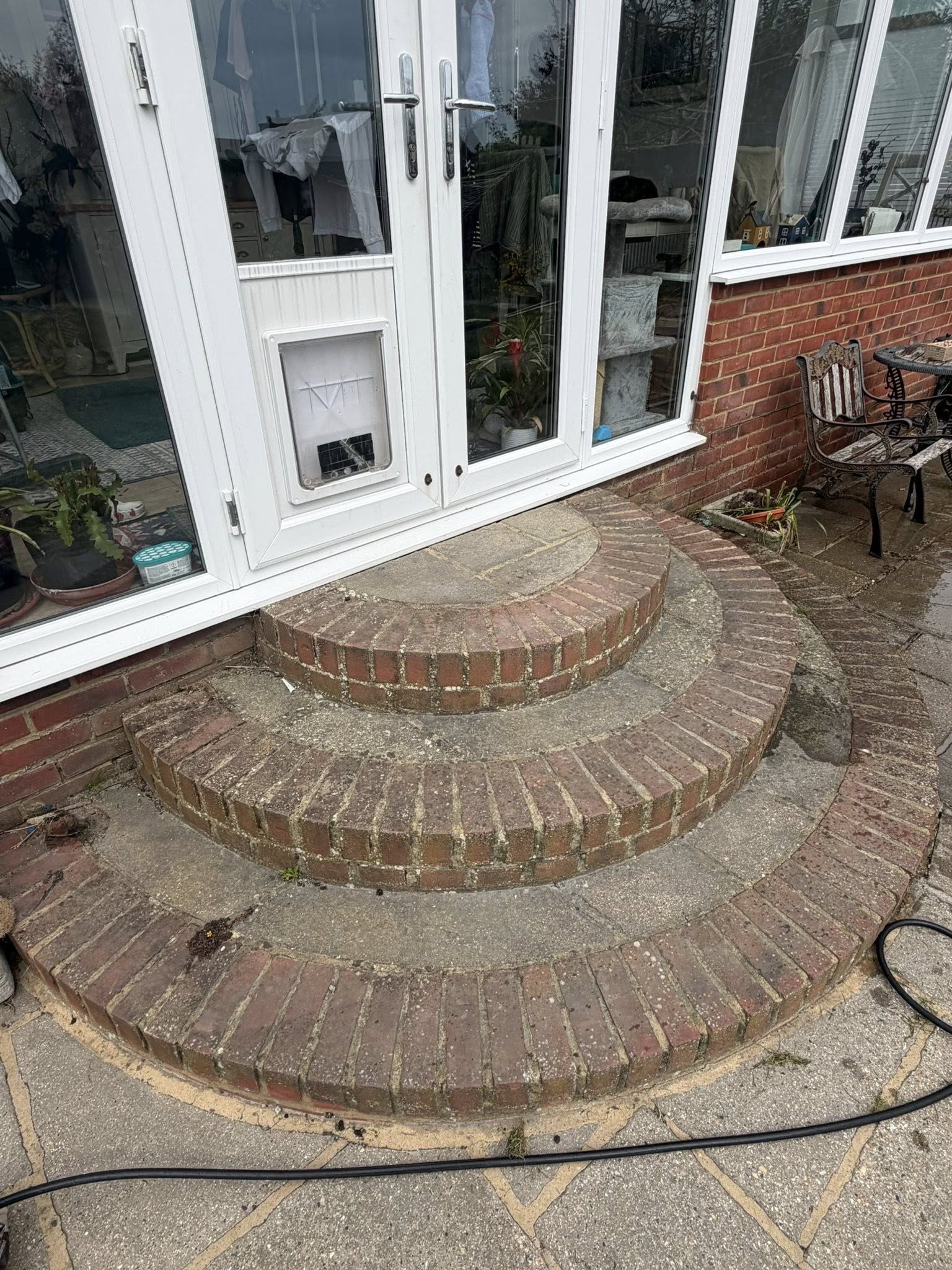 Brick patio steps before external cleaning service
